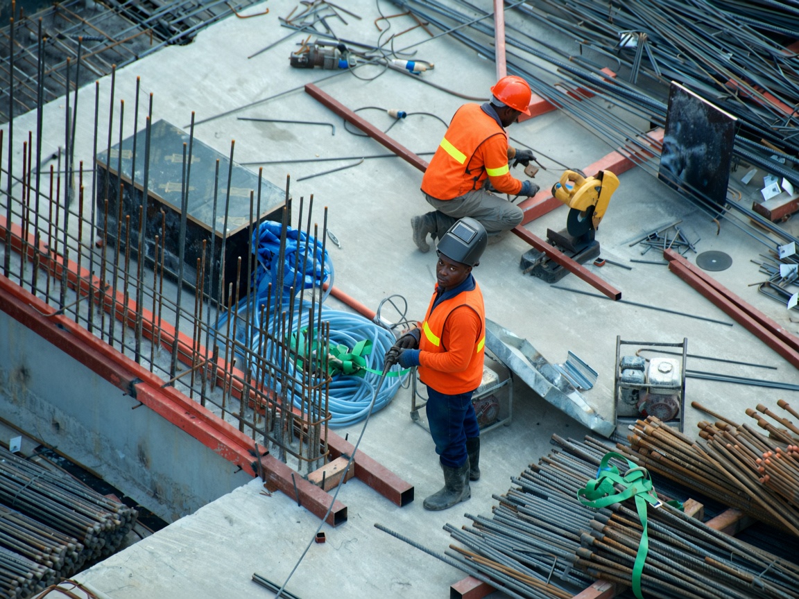 HIGH COAT crew working steel and concrete on site