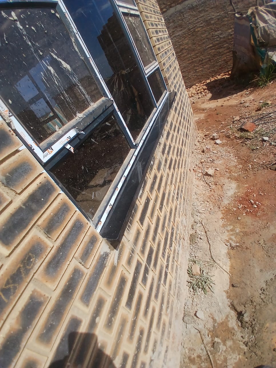 Exterior granite window sill on brickwork