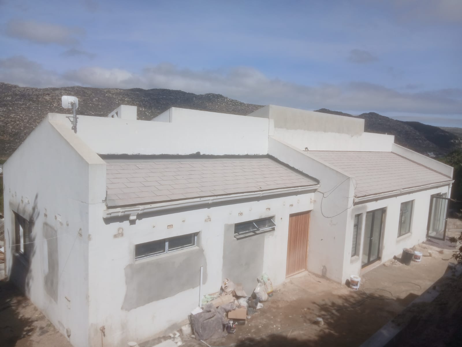 Residential building with new roof and exterior finishes
