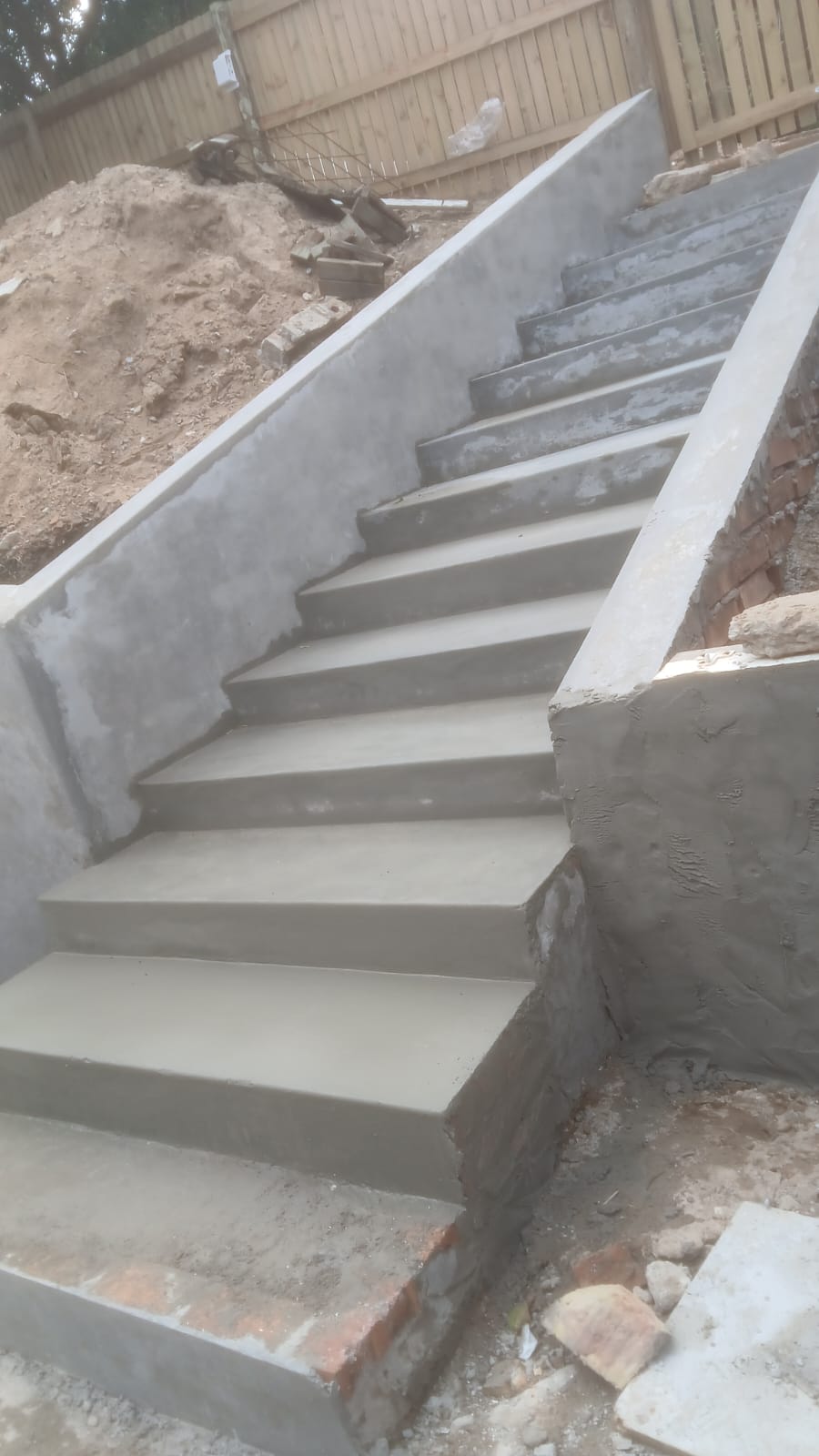 Freshly formed concrete staircase on a HIGH COAT site